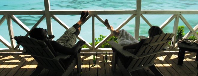 Relaxing on the patio, enjoying the view of the blue waters below